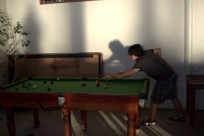 Matiu playing pool